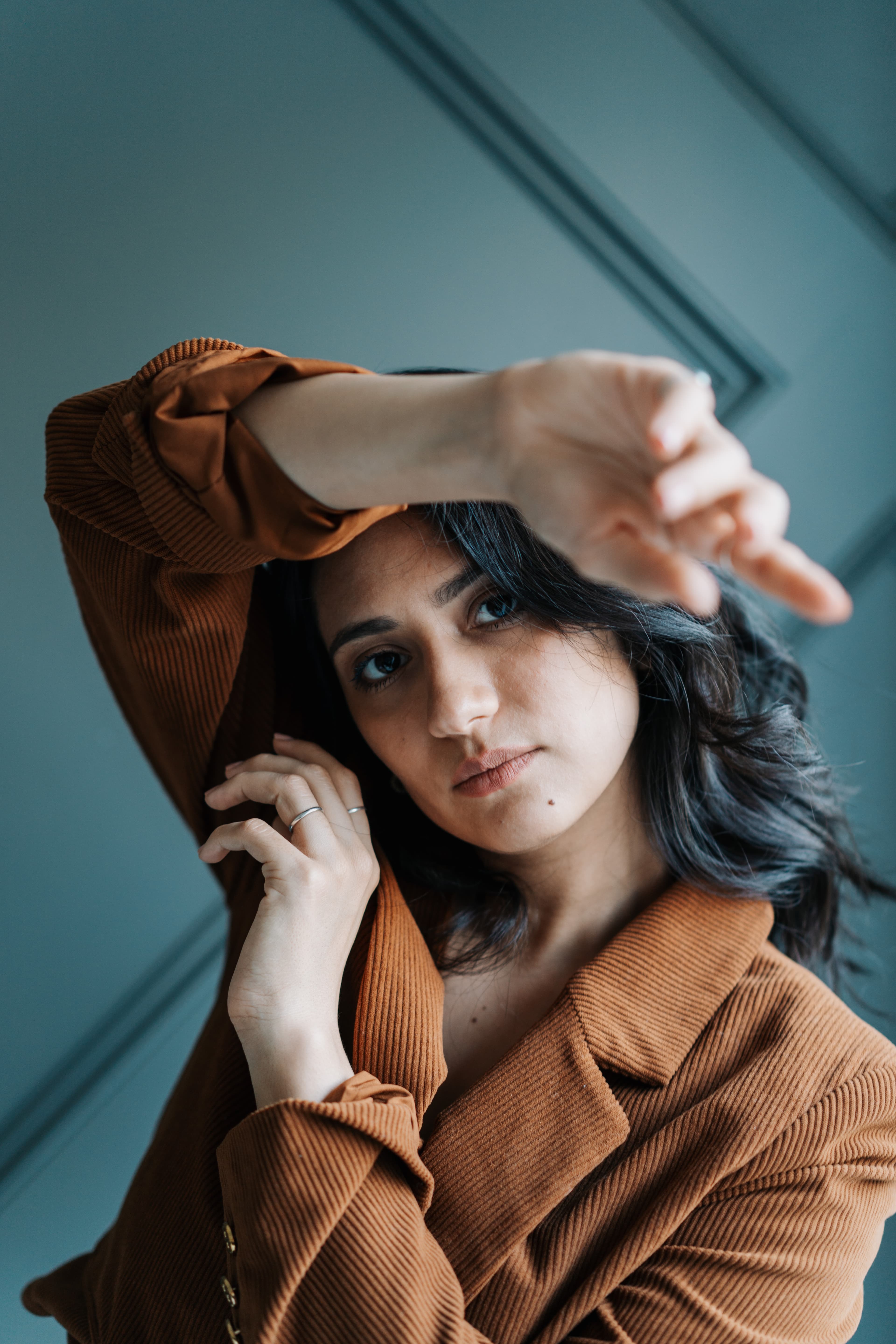 Portrait of Amberly Daniels in a rust blazer